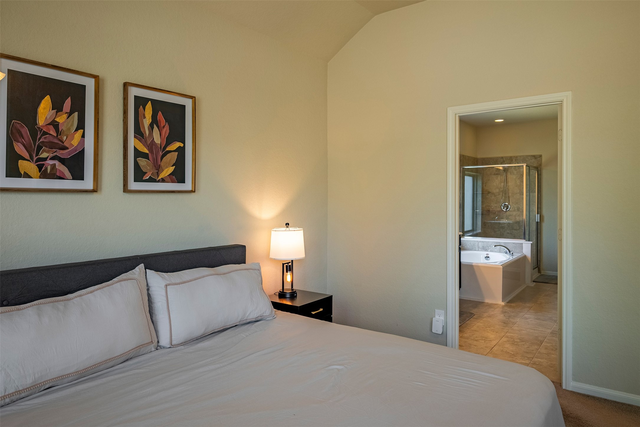 4423 Hidden Oaks Way Houston, TX 77084 - Photo 17 of 29 a bedroom with a bed and a lamp