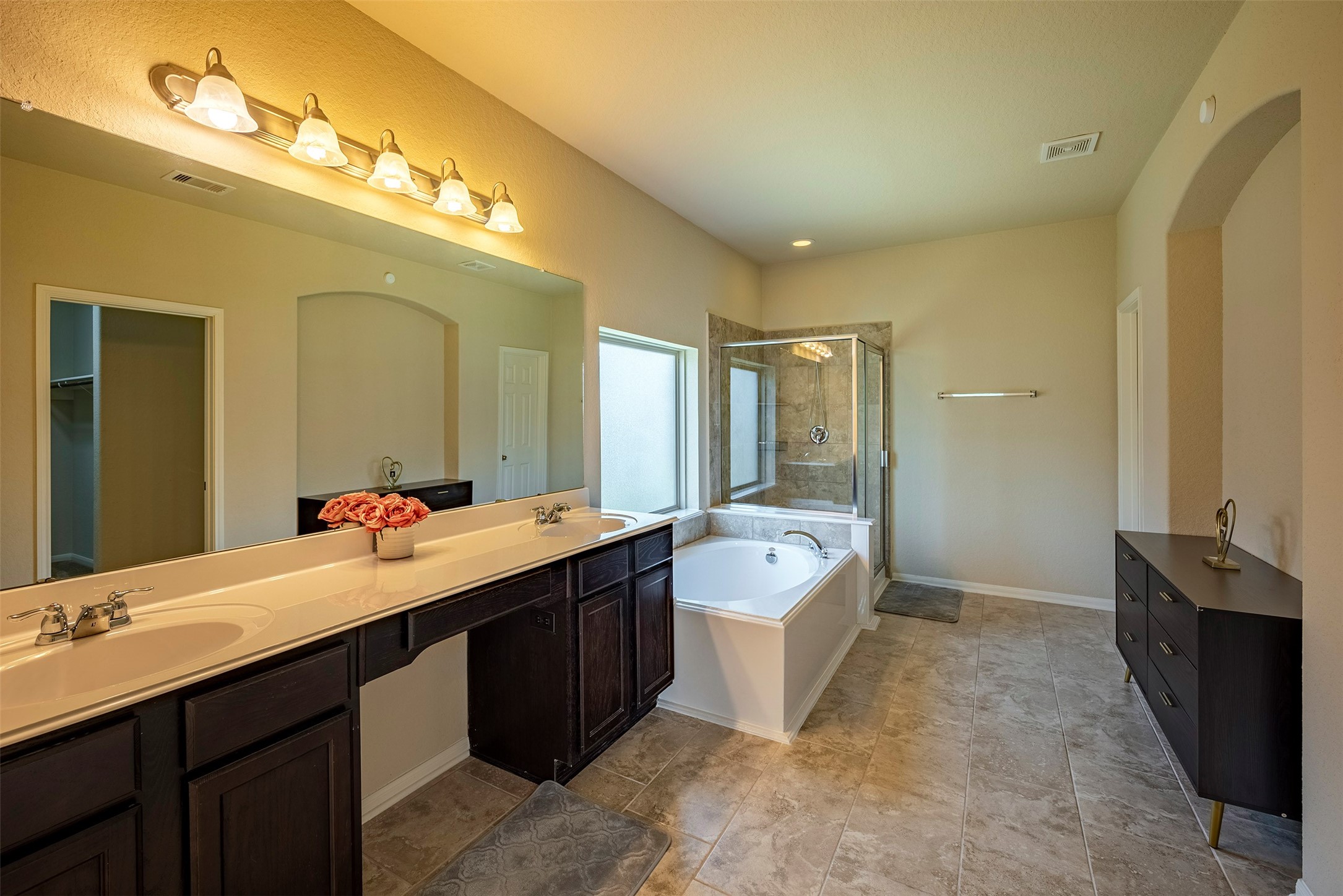 4423 Hidden Oaks Way Houston, TX 77084 - Photo 19 of 29 a bathroom with a double vanity sink mirror and toilet