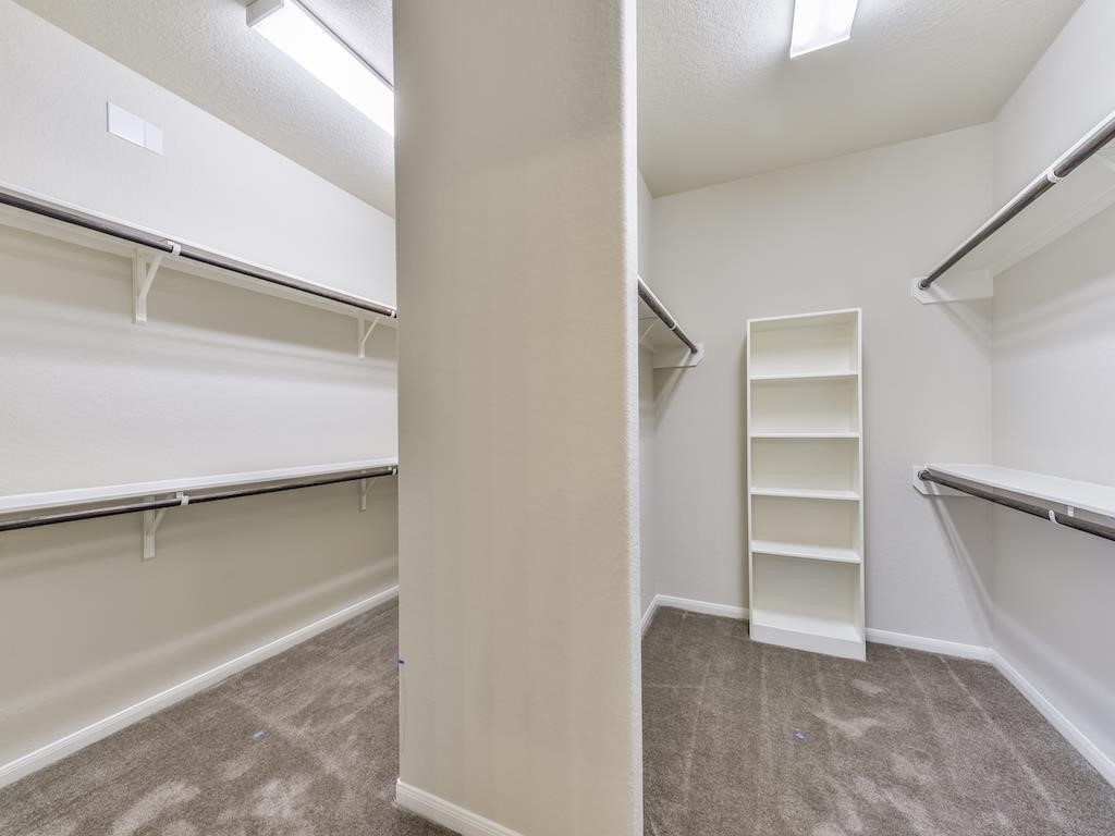 4423 Hidden Oaks Way Houston, TX 77084 - Photo 20 of 29 a view of an empty walk in closet