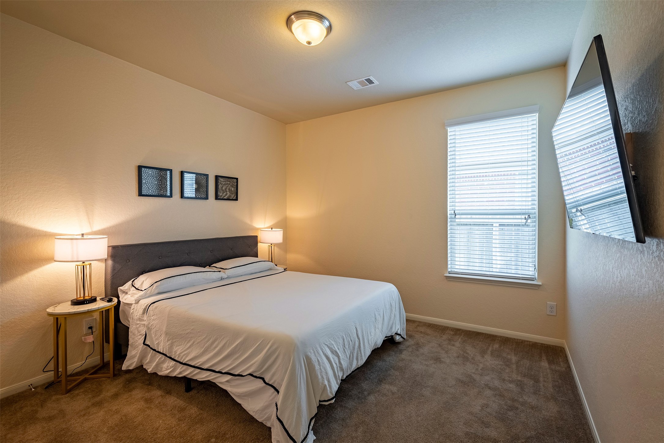 4423 Hidden Oaks Way Houston, TX 77084 - Photo 22 of 29 a bedroom with a bed and a window