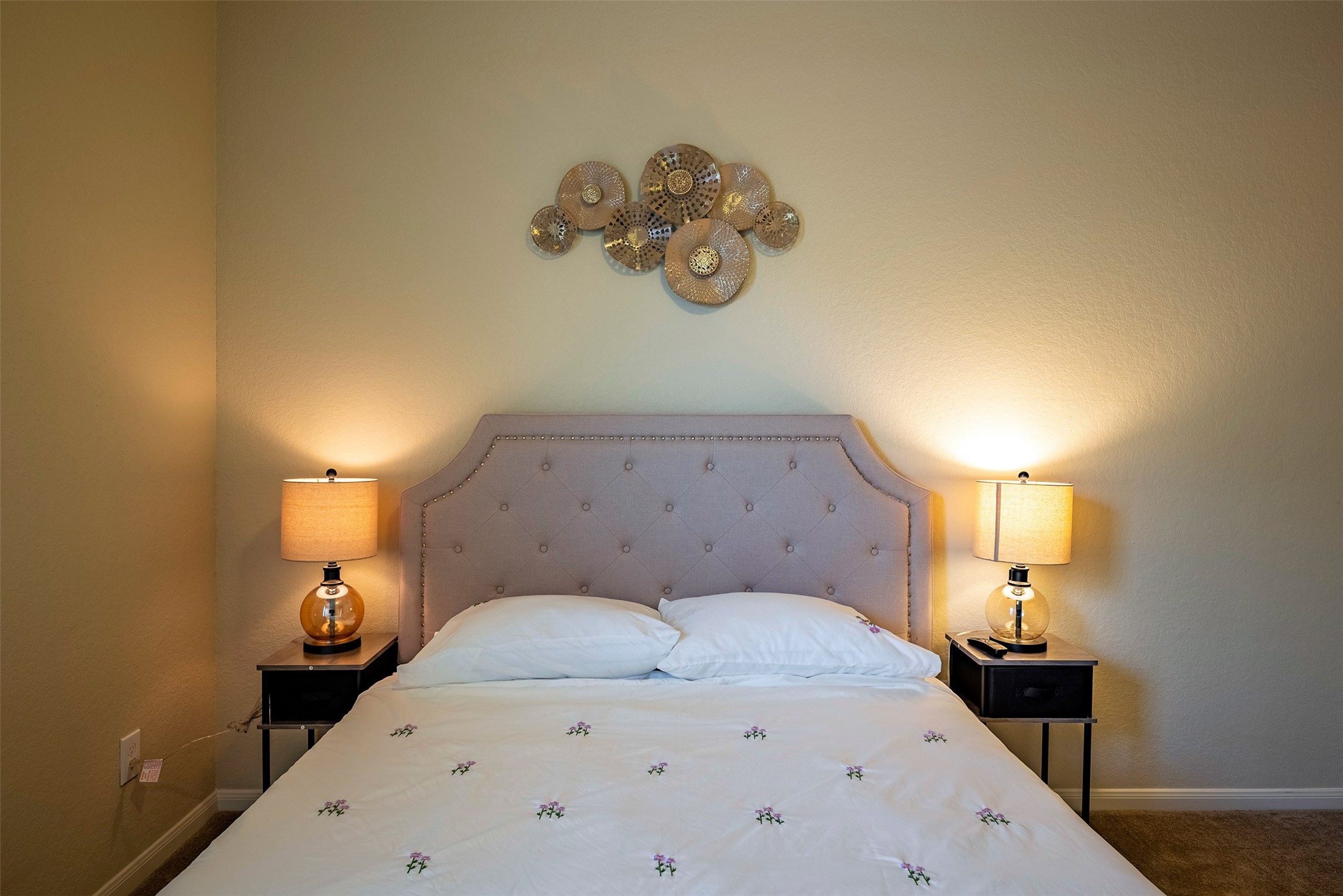 4423 Hidden Oaks Way Houston, TX 77084 - Photo 24 of 29 a bedroom with a bed and a chandelier