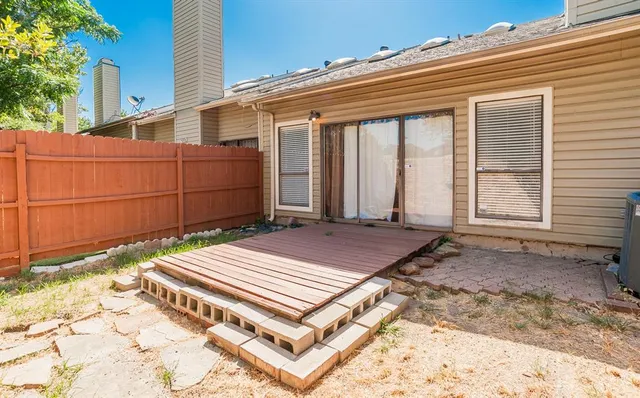a wooden bench sitting on top of a wooden floor