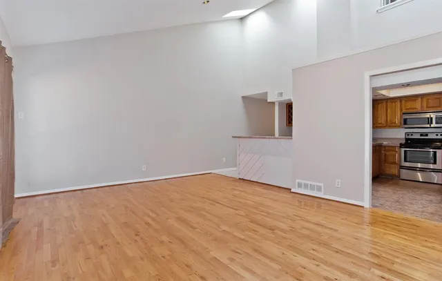 a view of a kitchen from the hallway