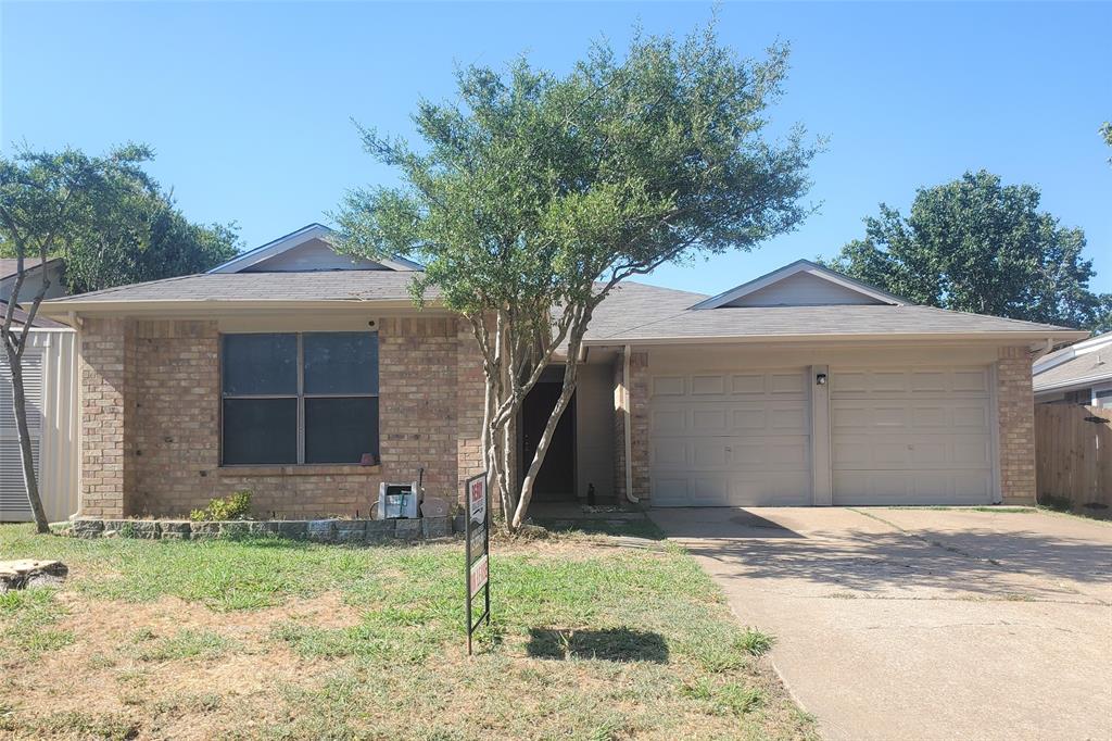 117 Valley Spring Drive Arlington, TX 76018 - Photo 1 of 9 a front view of a house with a yard