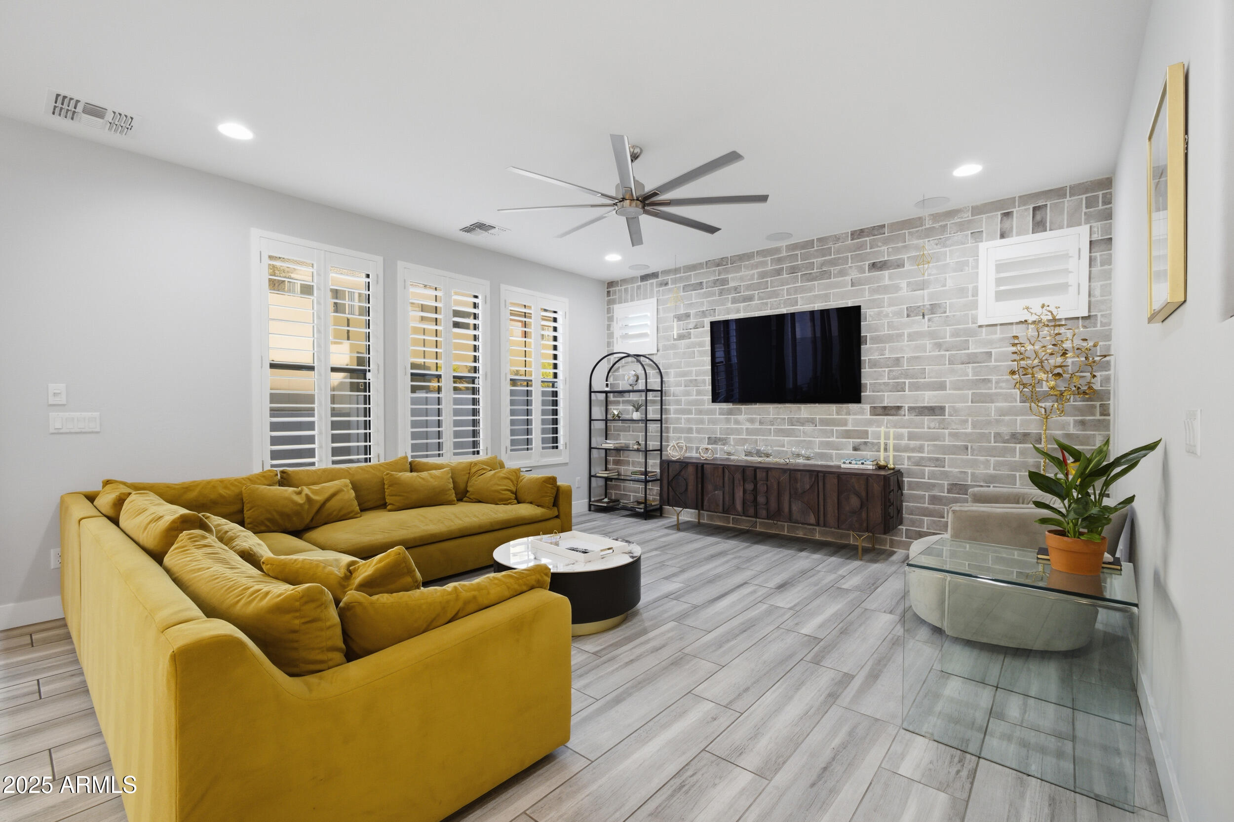 630 West Deer Creek Road Phoenix, AZ 85048 - Photo 14 of 47 a living room with furniture and a flat screen tv