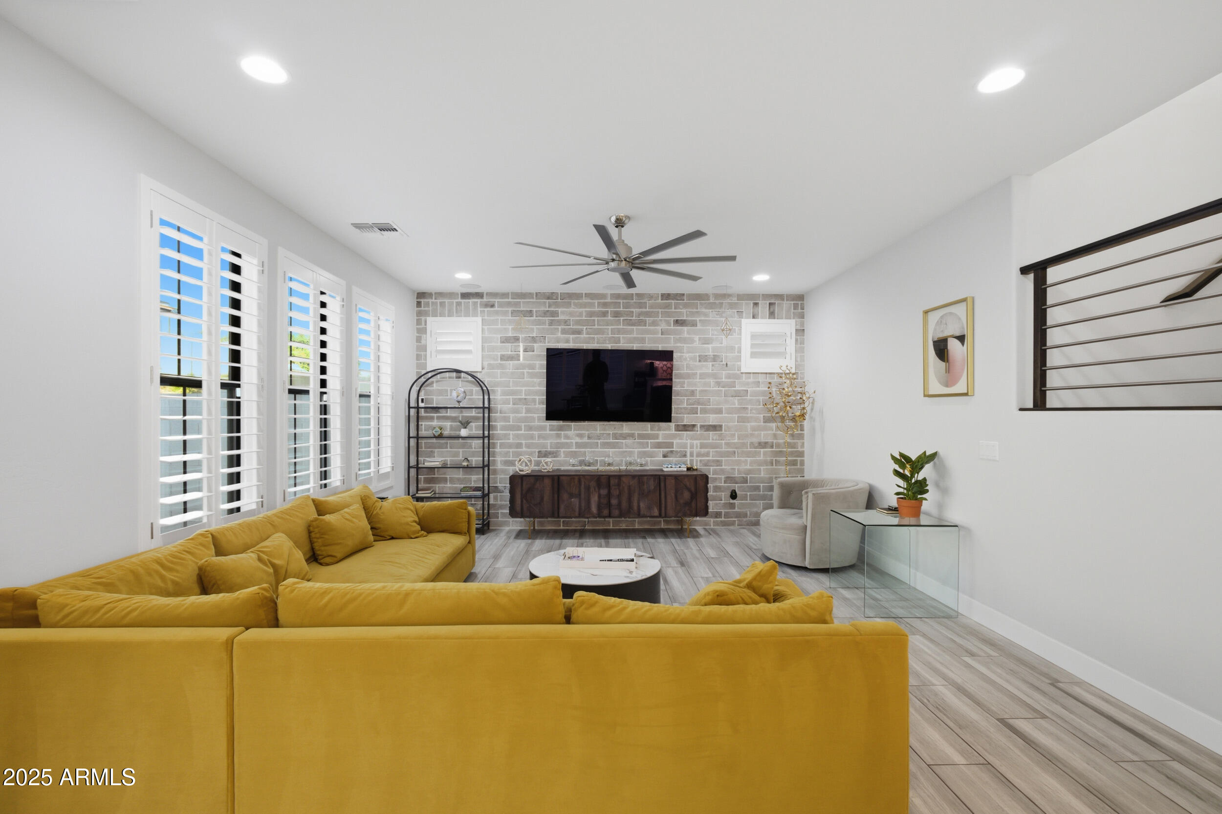 630 West Deer Creek Road Phoenix, AZ 85048 - Photo 15 of 47 a living room with furniture and a flat screen tv