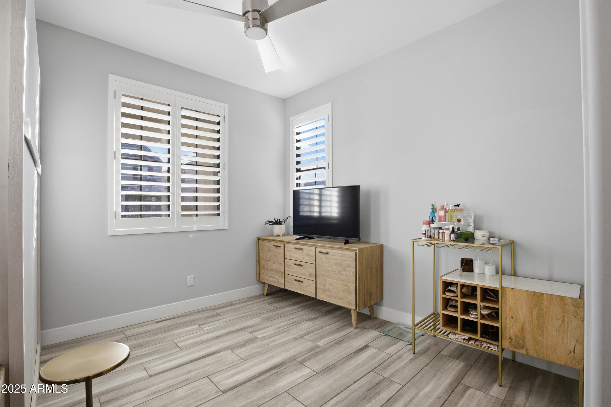630 West Deer Creek Road Phoenix, AZ 85048 - Photo 25 of 47 a living room with furniture and a flat screen tv