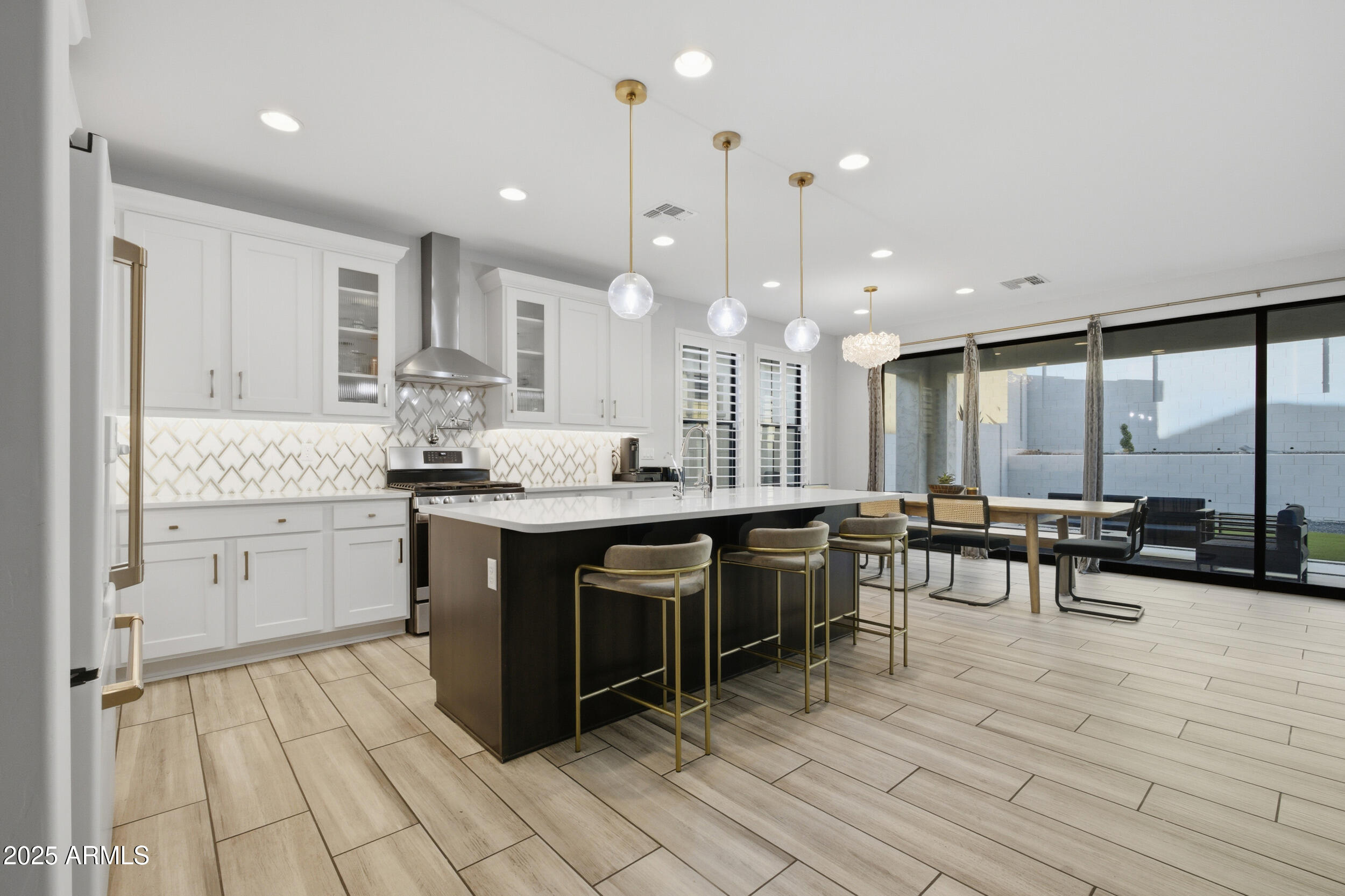 630 West Deer Creek Road Phoenix, AZ 85048 - Photo 4 of 47 a kitchen with a sink stove and cabinets