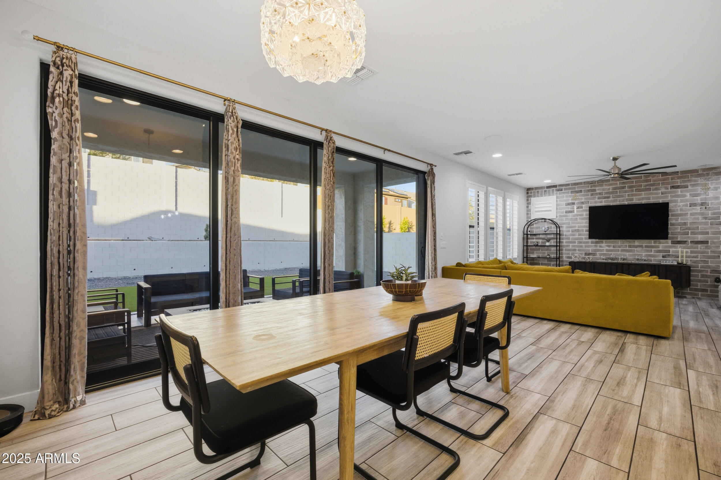 630 West Deer Creek Road Phoenix, AZ 85048 - Photo 5 of 47 a view of a dining room with furniture window and wooden floor