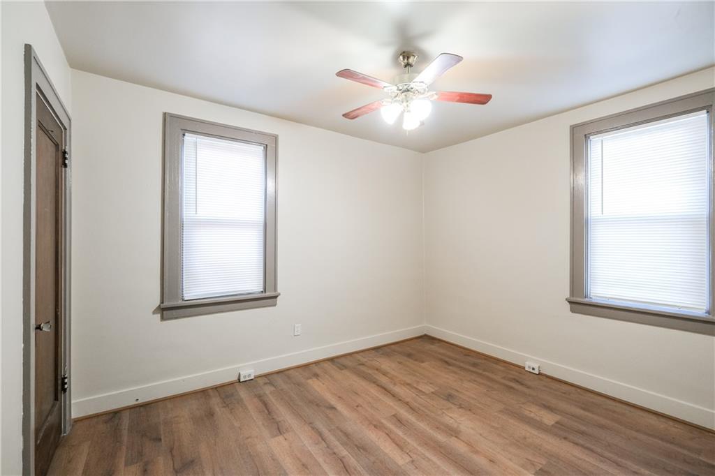 1326 Woodland Avenue Pittsburgh, PA 15212 - Photo 12 of 16 a view of an empty room with wooden floor and a window