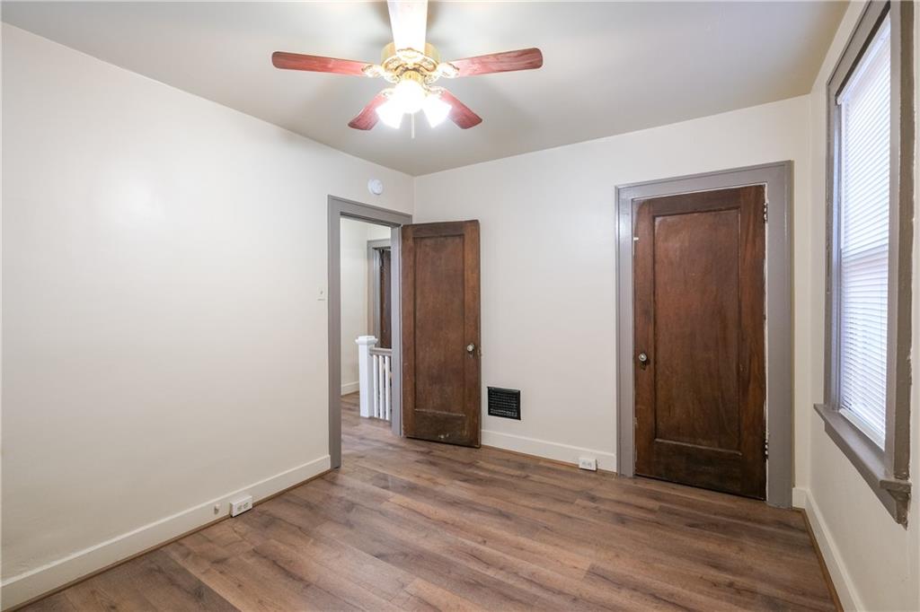1326 Woodland Avenue Pittsburgh, PA 15212 - Photo 13 of 16 a view of an empty room with wooden floor