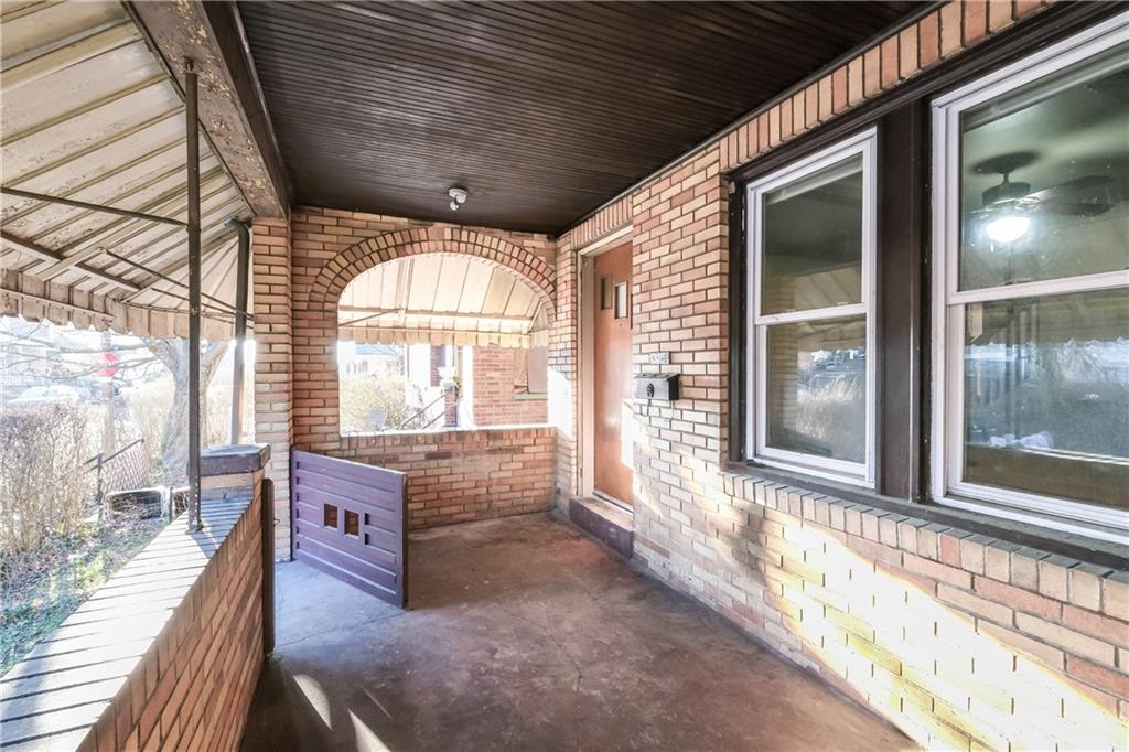 1326 Woodland Avenue Pittsburgh, PA 15212 - Photo 15 of 16 a living room with furniture and a floor to ceiling window