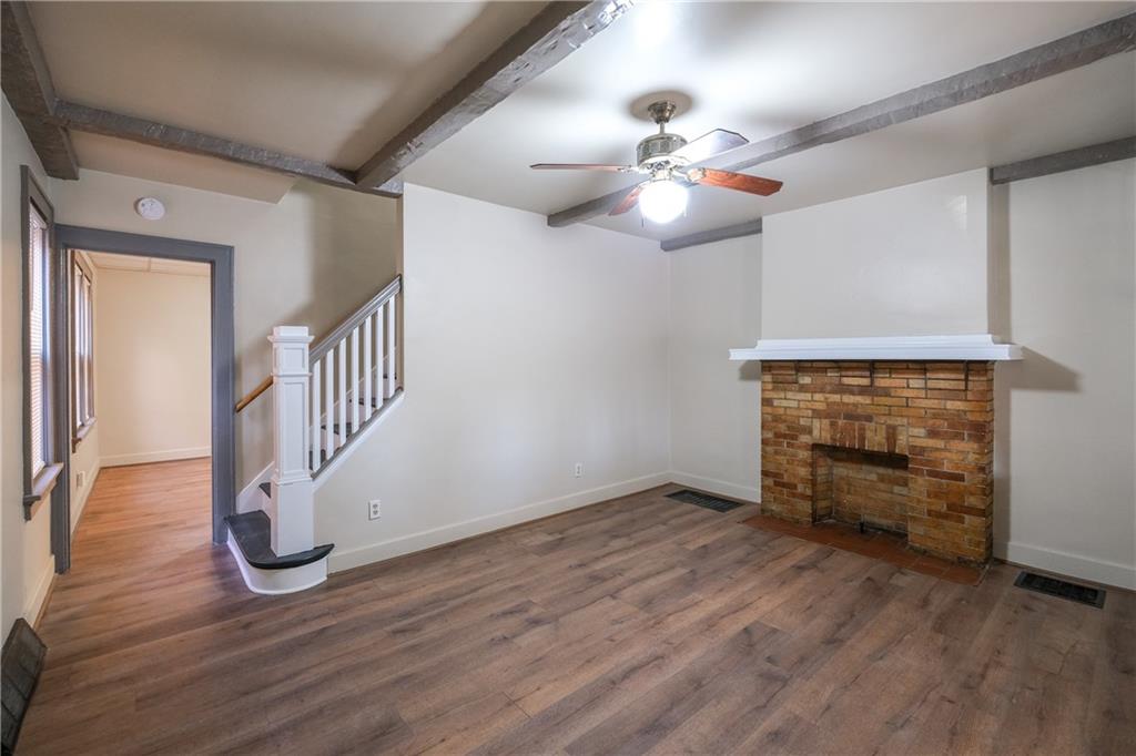 1326 Woodland Avenue Pittsburgh, PA 15212 - Photo 2 of 16 wooden floor in an empty room with a window
