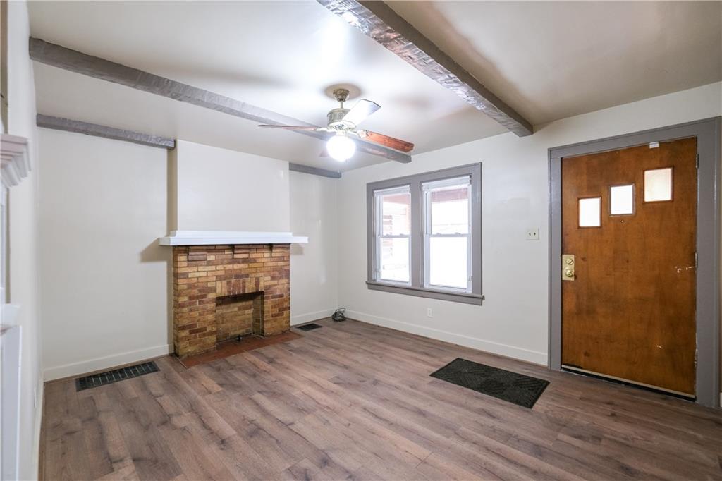 1326 Woodland Avenue Pittsburgh, PA 15212 - Photo 3 of 16 wooden floor in an empty room with a window