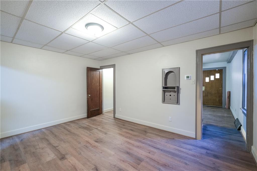 1326 Woodland Avenue Pittsburgh, PA 15212 - Photo 4 of 16 wooden floor in an empty room with a window
