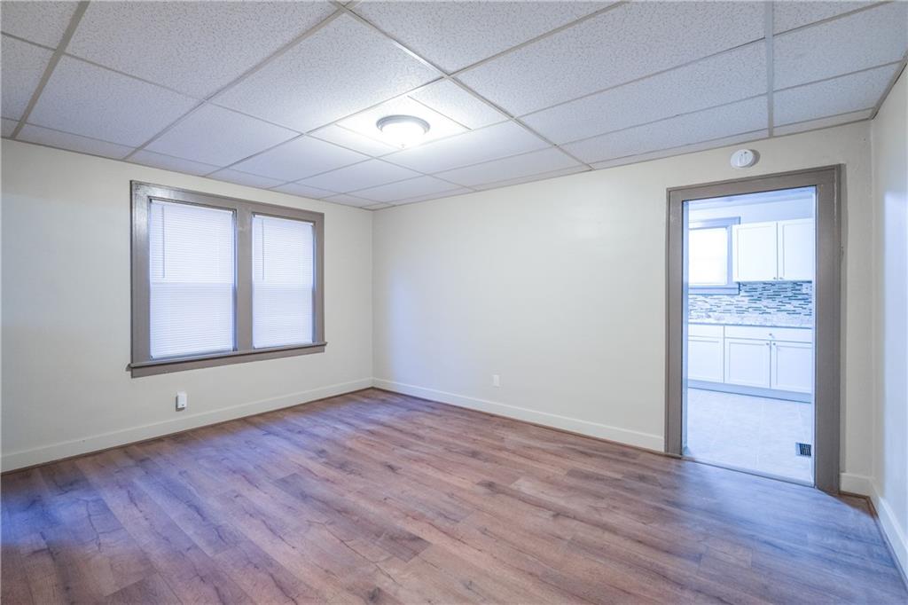 1326 Woodland Avenue Pittsburgh, PA 15212 - Photo 5 of 16 wooden floor in an empty room with a window