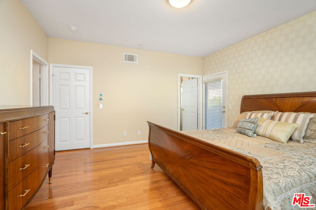 1128 West Duarte Road, Unit A Arcadia, CA 91007 - Photo 19 of 28 a bedroom with a bed and a dresser