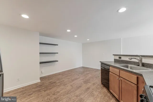 a kitchen with a sink and cabinets