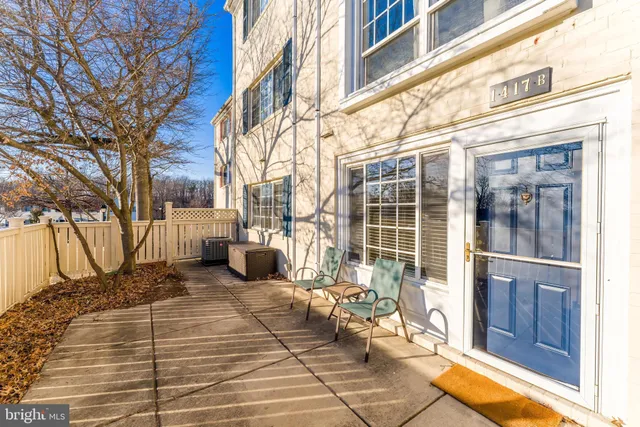 a view of a brick building with a bench in front of building
