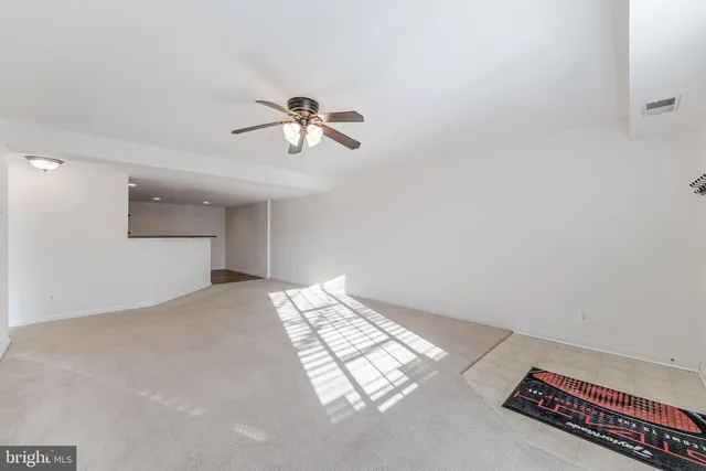 a view of an empty room and a window