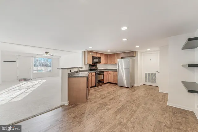 a kitchen with white cabinets and white stainless steel appliances