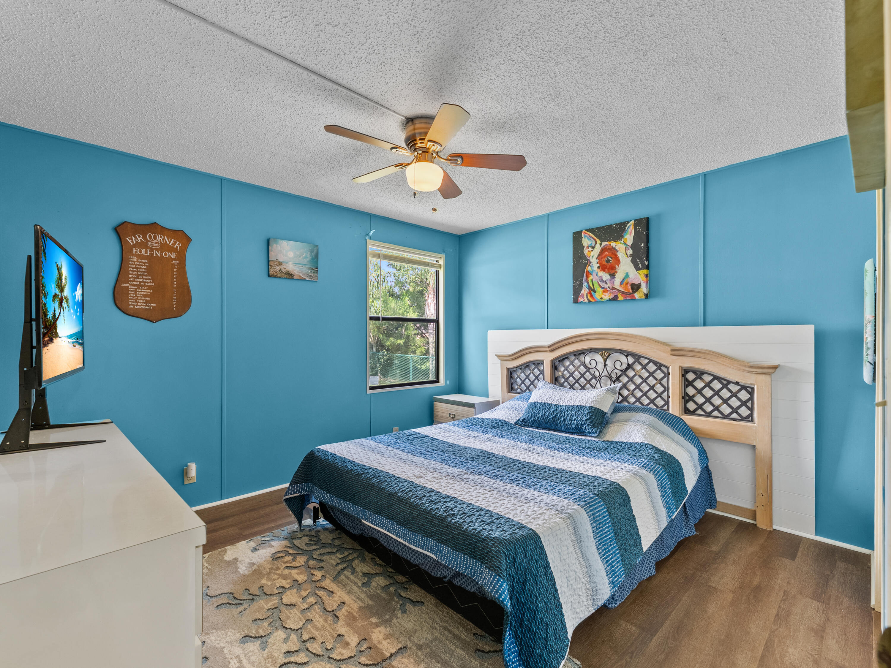 2855 Southwest Monarch Trail Stuart, FL 34997 - Photo 21 of 29 a bedroom with a bed and a window