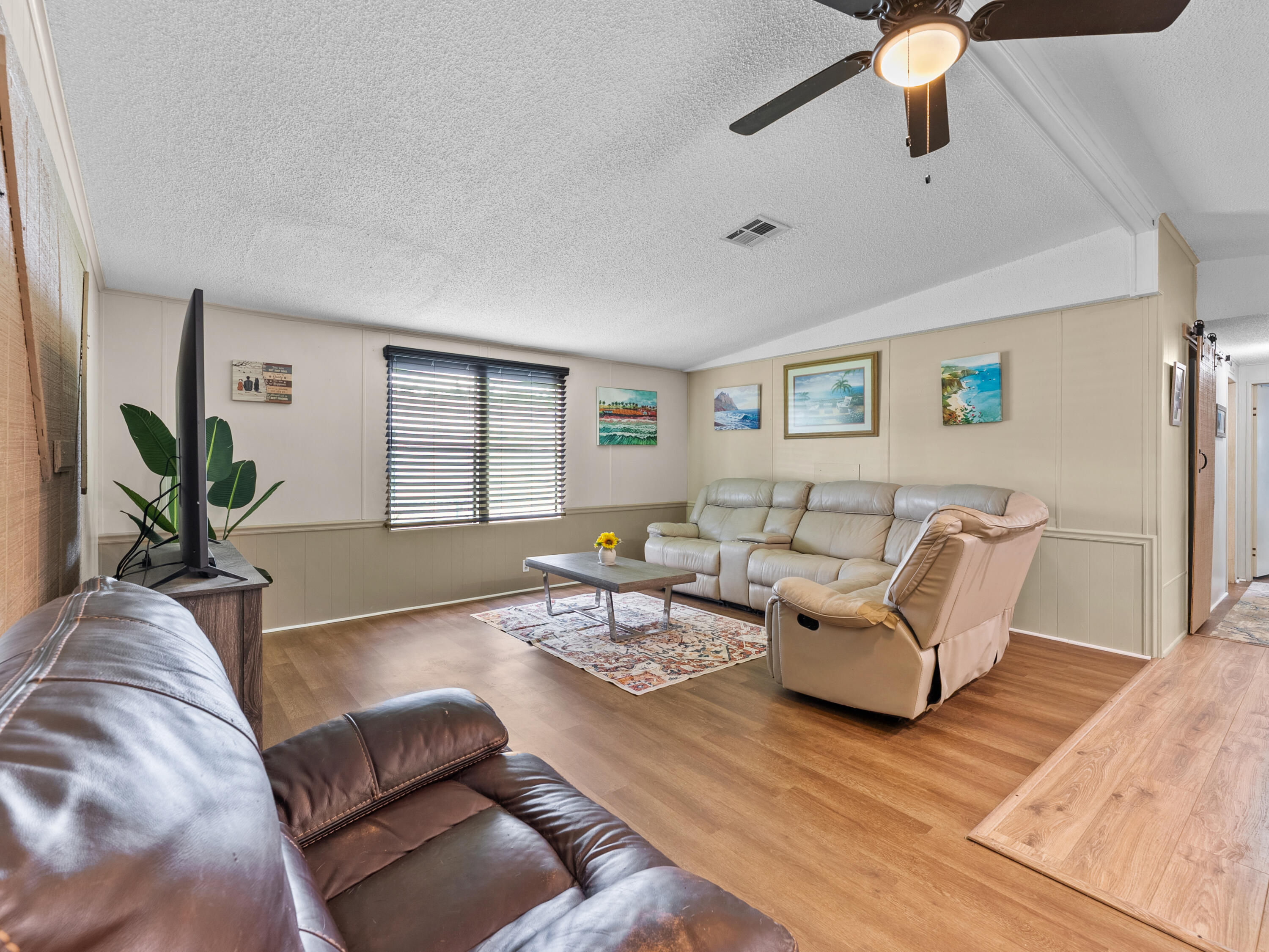2855 Southwest Monarch Trail Stuart, FL 34997 - Photo 6 of 29 a living room with furniture