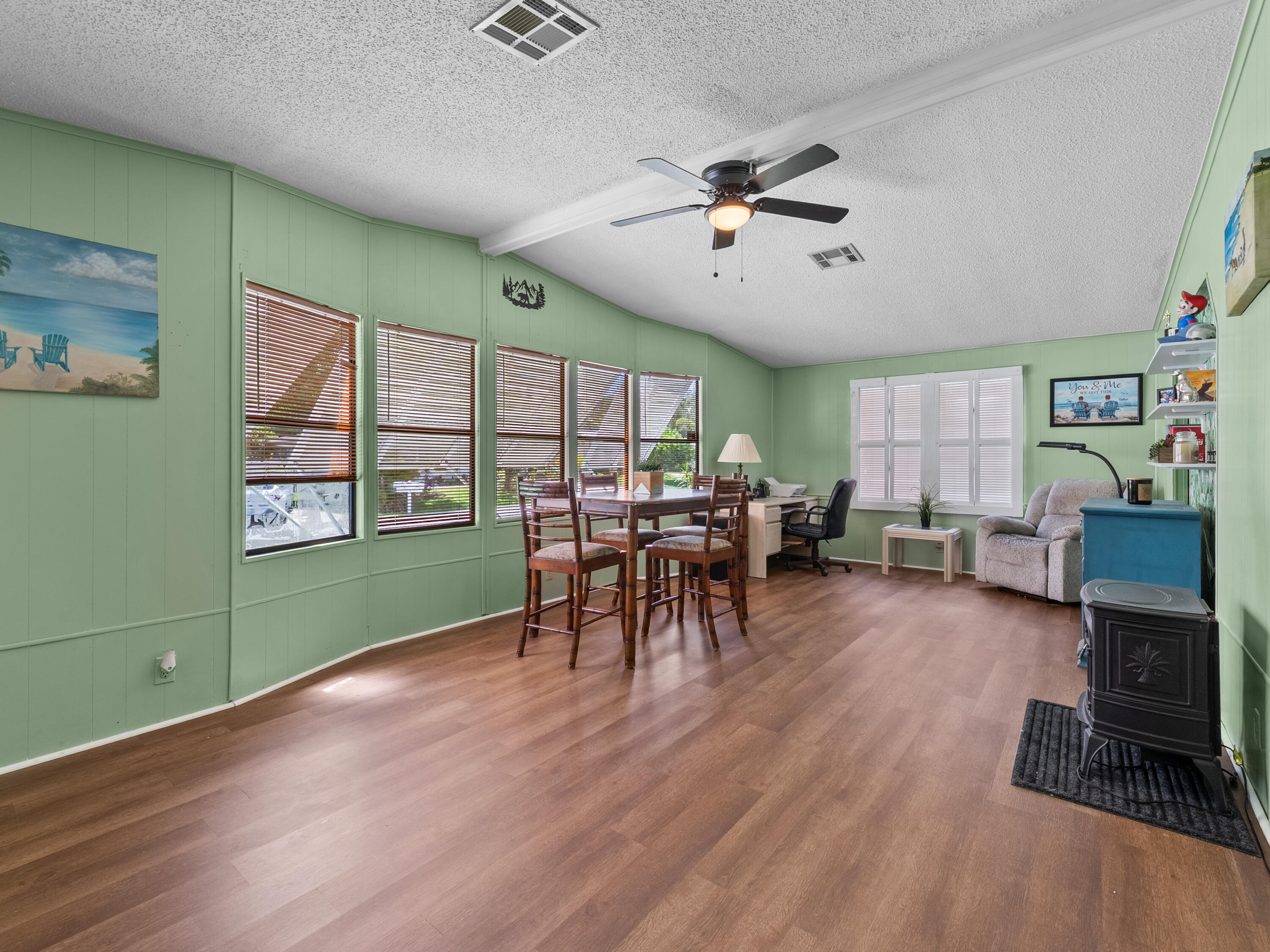 2855 Southwest Monarch Trail Stuart, FL 34997 - Photo 7 of 29 a living room with furniture and a window