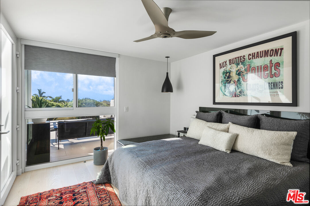 31201 Bailard Road Malibu, CA 90265 - Photo 23 of 56 a bedroom with a large bed and a large window