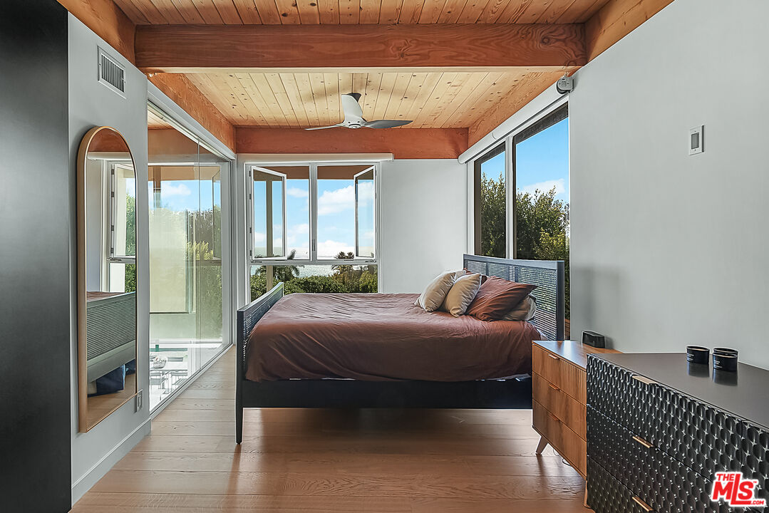 31201 Bailard Road Malibu, CA 90265 - Photo 26 of 56 a bed room with a bed and a large window
