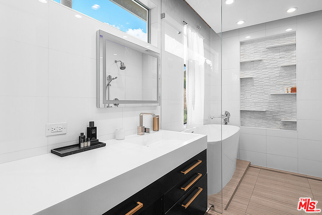 31201 Bailard Road Malibu, CA 90265 - Photo 27 of 56 a bathroom with a sink double vanity and a mirror