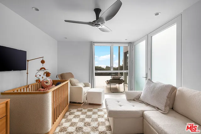 a living room with furniture tv and a fireplace