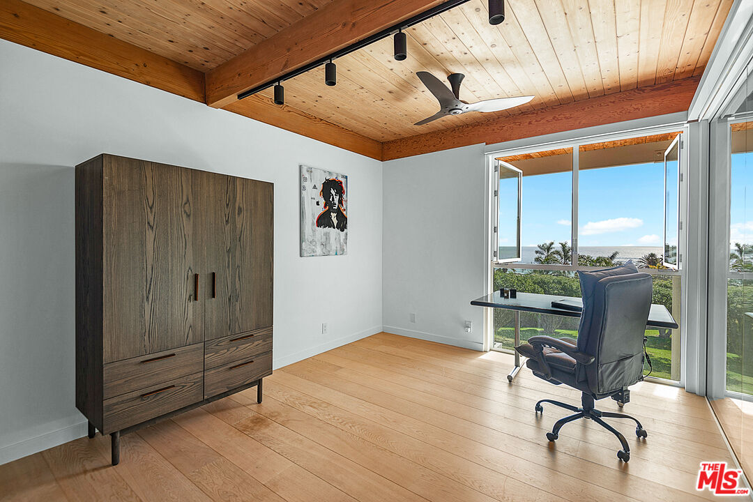 31201 Bailard Road Malibu, CA 90265 - Photo 33 of 56 a workspace with furniture and wooden floor