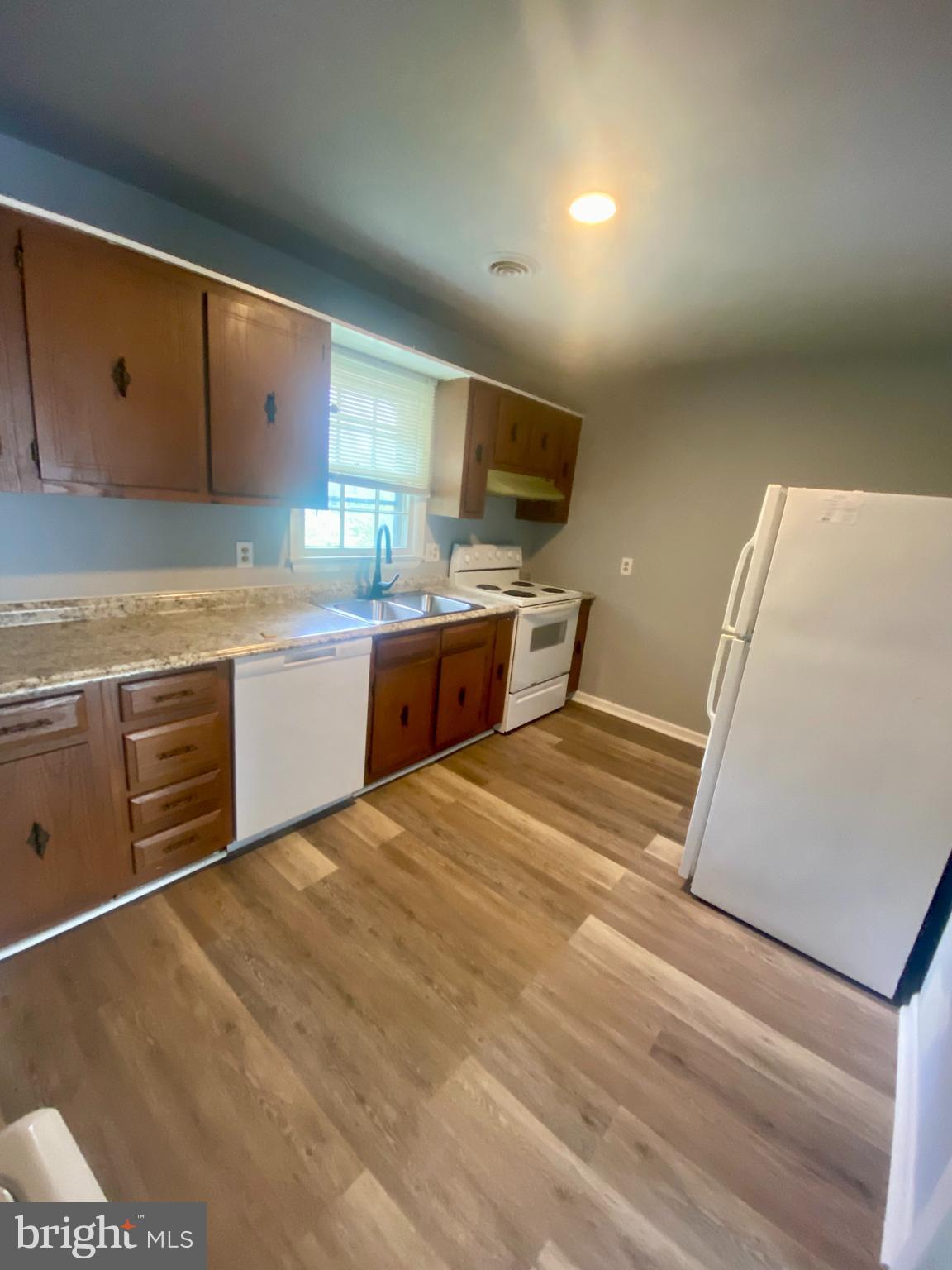 1417 Dandridge Street, Unit C Fredericksburg, VA 22401 - Photo 2 of 10 a large kitchen with stainless steel appliances granite countertop a sink and cabinets