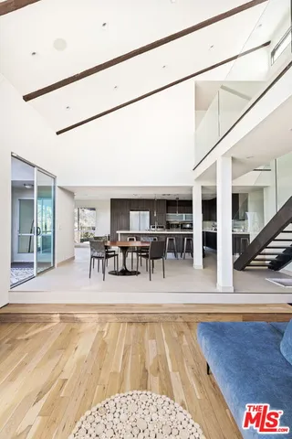 a view of a swimming pool with outdoor seating