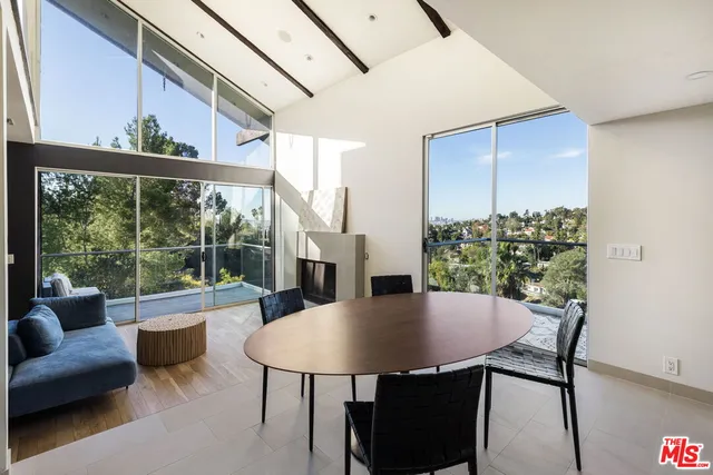 a view of a dining room with furniture window and outside view