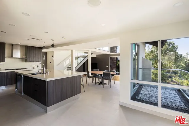 a kitchen with stainless steel appliances granite countertop a stove and a refrigerator