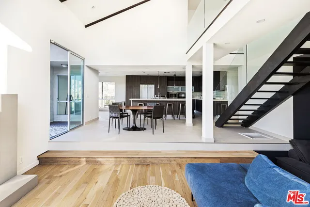 a view of a living room and dining room