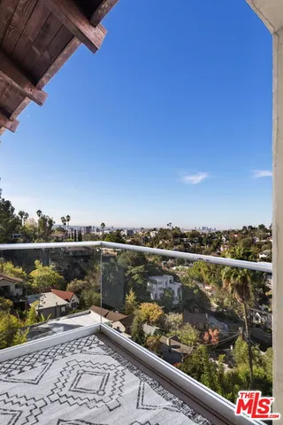 a view of a city skyline from a balcony