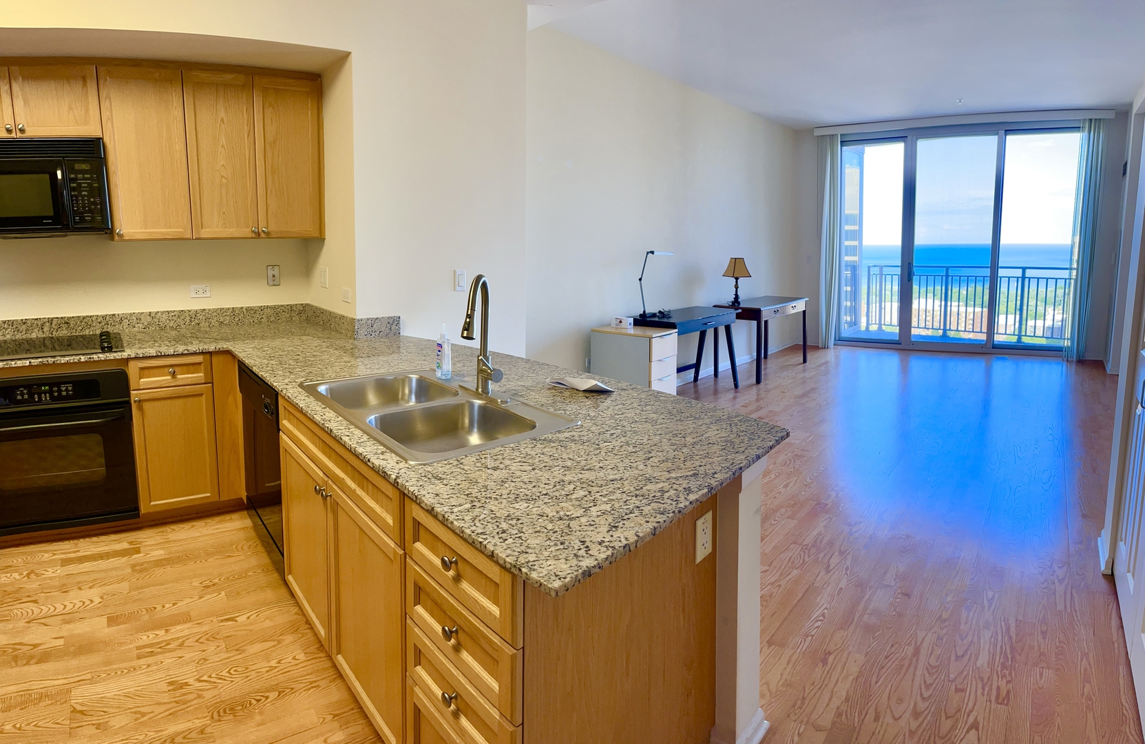 807 Davis Street, Unit 2210 Evanston, IL 60201 - Photo 2 of 10 a kitchen with stainless steel appliances granite countertop a sink stove and cabinets