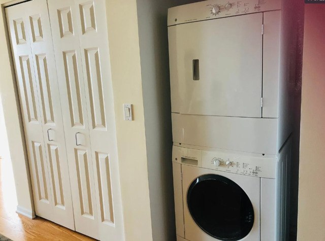 807 Davis Street, Unit 2210 Evanston, IL 60201 - Photo 8 of 10 a view of a hallway with washer and dryer