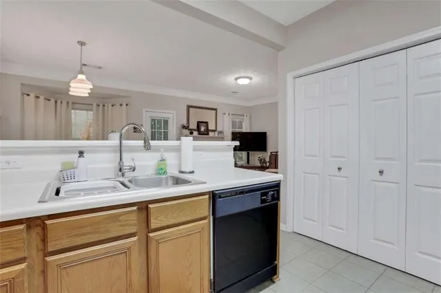 a kitchen with a sink and cabinets