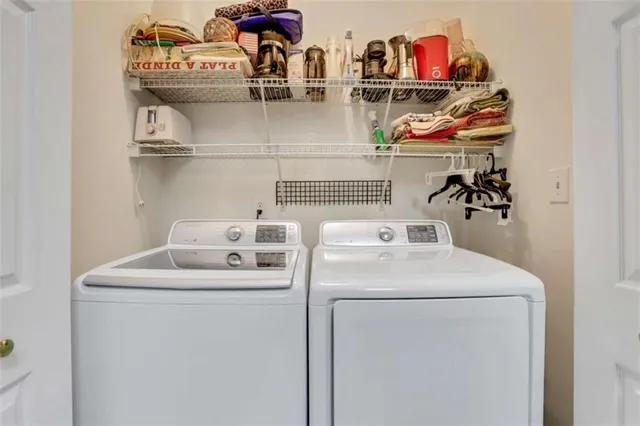 a utility room with dryer and washer
