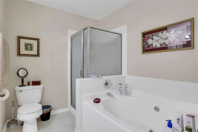 a bathroom with a sink mirror and toilet