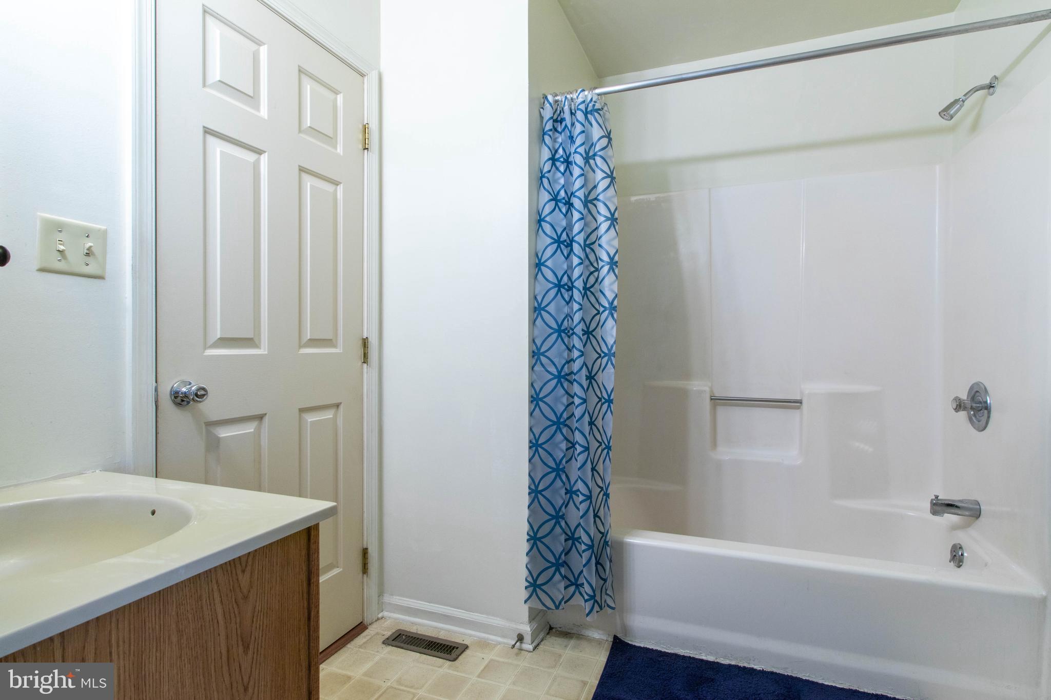 608 Rosedale Road Kennett Square, PA 19348 - Photo 12 of 30 a bathroom with a shower curtain and a sink