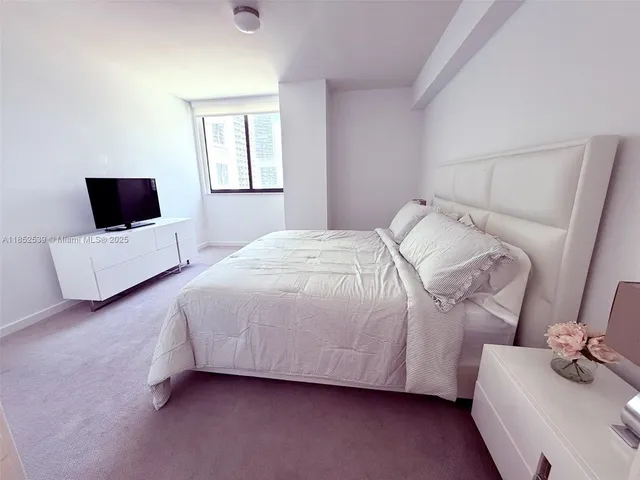 a kitchen with a sink and refrigerator