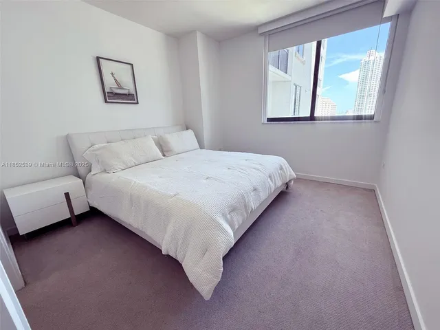 a bathroom with a granite countertop toilet a sink and a bathtub
