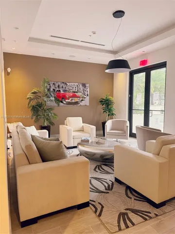 a living room with couch and a flat screen tv