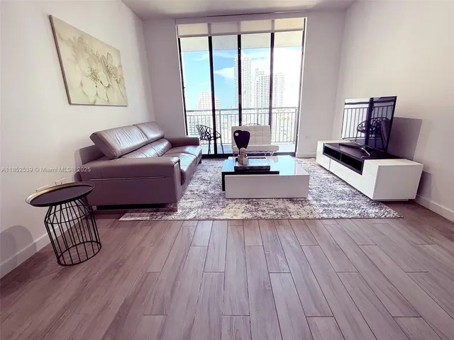 a kitchen with stainless steel appliances granite countertop a refrigerator sink and microwave