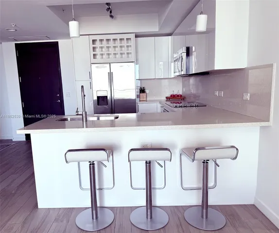 a view of a room with a potted plant